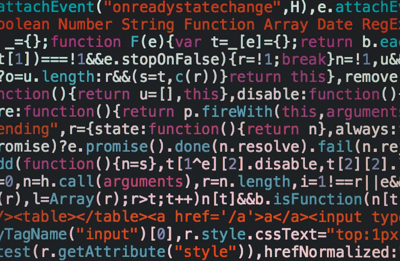 产品 Close-up of colorful coding text on a dark computer screen, representing software development.